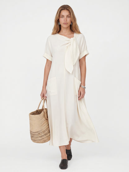Vera | Effortless Flowy Maxi Dress with Bow Neckline & Front Pockets — Beige_front